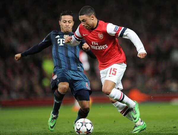 Arsenal's Oxlade-Chamberlain Clashes with Bayern's Thiago in Champions League Showdown