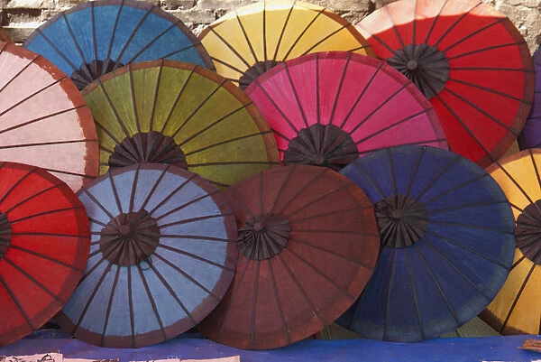 Laos, Northern Laos, Luang Prabang (Luang Phabang), colourful parasols for sale on the main street