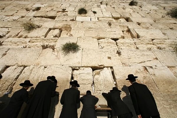 Ultra-orthodox Jewish men pray at the Western Wall in the Old City of Jerusalem
