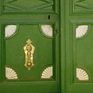 Detail of panels in a door with knocker at Piedrahita