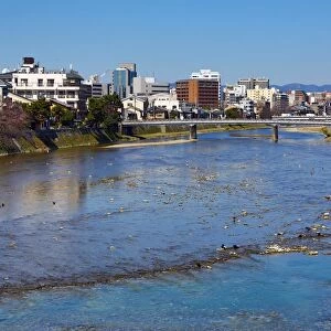 River Kamo and general city view of Kyoto, Japan