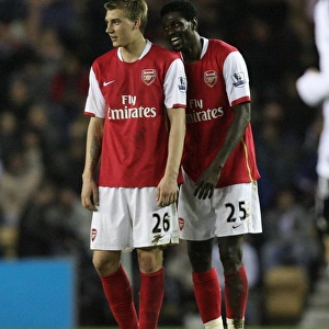 Emmanuel Adebayor (Arsenal) shares a joke with Nicklas Bendtner