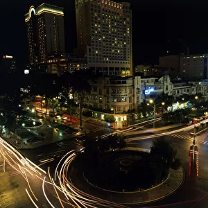 Vietnam, Ho Chi Minh City, busy roundabout at night
