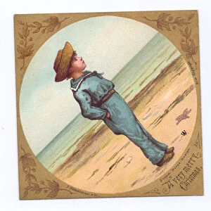 A Victorian Christmas card of a little boy wearing a straw hat