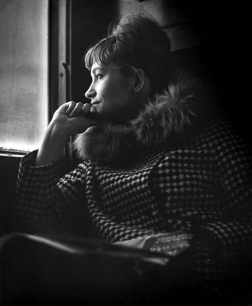Fashionable young woman in a train