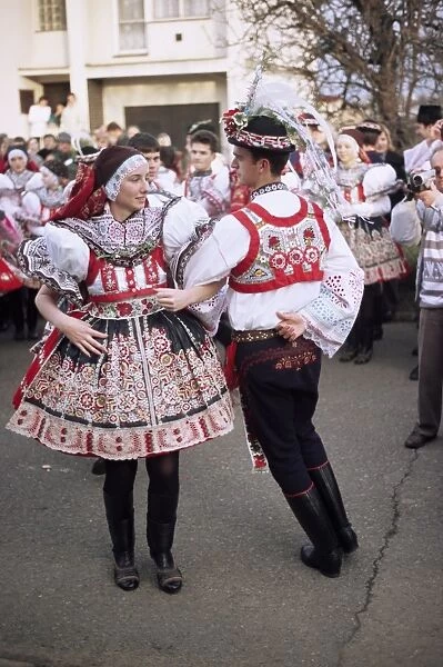 Chosen couple in traditional dress, dancing, St. Martin Feast with Wreath Festival