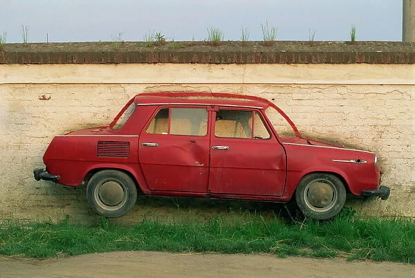 Half a Skoda on a wall in a car salesyard near Piestany