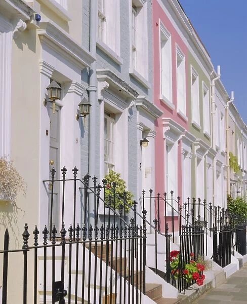 Terraced houses and wrought iron railings, Kensington, London, England, UK