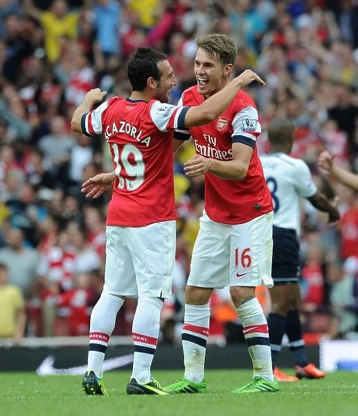 Arsenal Celebration: Ramsey and Cazorla Rejoice in Derby Victory over Tottenham, 2013-14