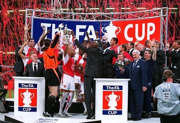 The Arsenal players celebrate lifting the FA Cup Trophy
