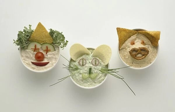 Bowls containing food made in to the shape of faces