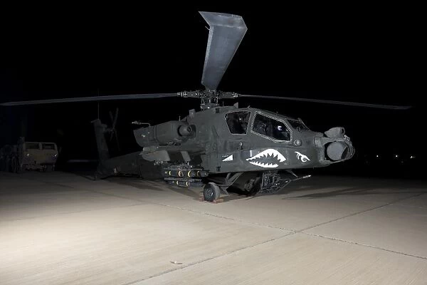 An AH-64D Apache Longbow at night, Tikrit, Iraq