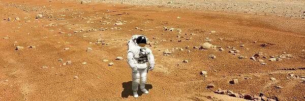 Astronaut looking up at an alien sun that illuminates the barren world he stands
