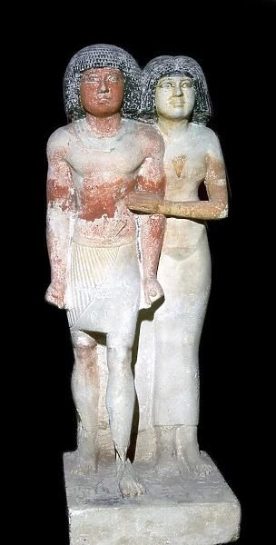 Egyptian sculpture of a man and his wife