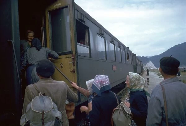 Local people boarding a train in Czechslovakia. Artist: CM Dixon