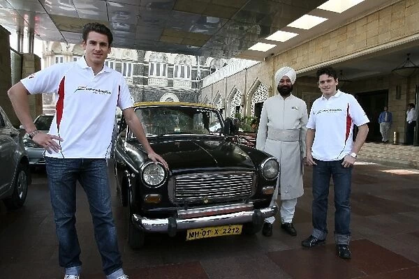 Force India F1 Drivers in Mumbai: R-L: Force India F1 Team mates Giancarlo Fisichella and Adrian Sutil with a Mumbai Taxi and driver