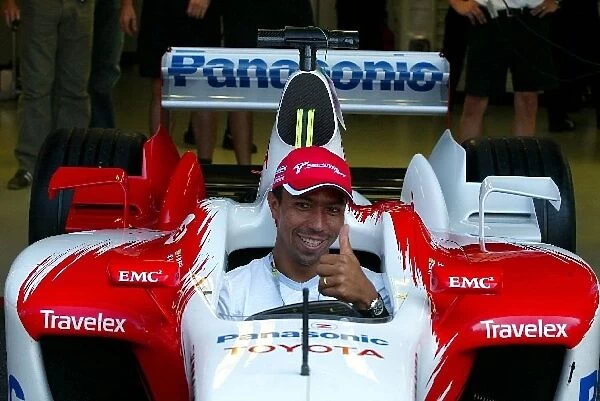 Formula One World Championship: Giovane Elber Bayern Munich Footballer sits in the Toyota TF103