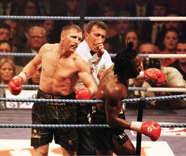Steve Collins connects with Nigel Benn during WBO Super Middleweight contest in