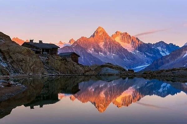 Colourful sunset on Lac Blanc lake in France Alps. Monte Bianco mountain range on background