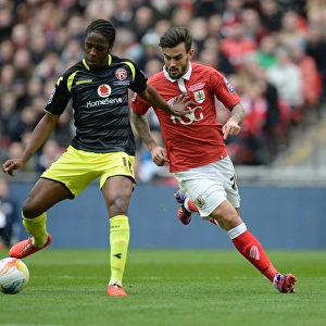 Bristol City vs Walsall: Intense Moment as Marlon Pack Challenges Romaine Sawyers at the Johnstone's Paint Trophy Final