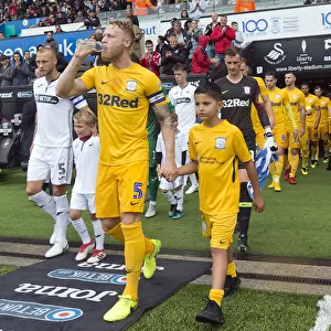 Skipper Tom Clarke Leads The Team Out At Swansea