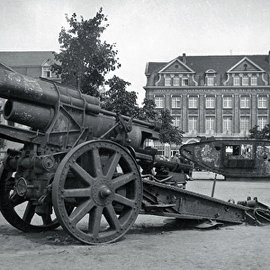 Field gun and tank in a town square