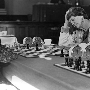 Women playing chess in a tournament