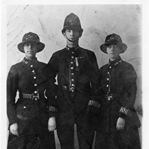 Two women police officers and a policeman, London