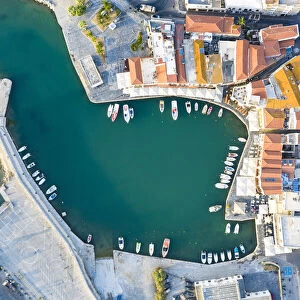 Aerial view of the old town and Venetian harbour overlooking the blue Aegean Sea, Rethymno, Crete island, Greek Islands, Greece, Europe