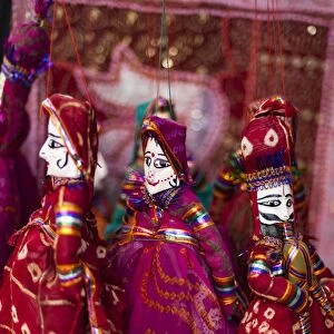 Colorful puppets hanging in a shop in Udaipur, Rajasthan, India, Asia