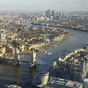Elevated view of the River Thames looking East towards Canary Wharf with Tower Bridge in the foreground, London, England, United Kingdom, Europe