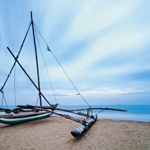 Outrigger fishing boat on Negombo Beach at sunrise, Sri Lanka, Asia