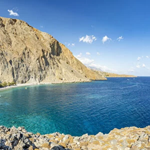 Panoramic view of white sand beach of Glyka Nera and crystal sea, Hora Sfakion, Crete island, Greek Islands, Greece, Europe