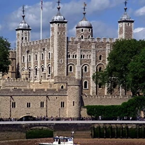 A police launch on the River Thames, passing the Tower of London, UNESCO World Heritage Site