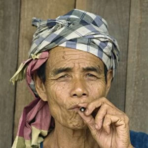 Portrait of refugee smoking