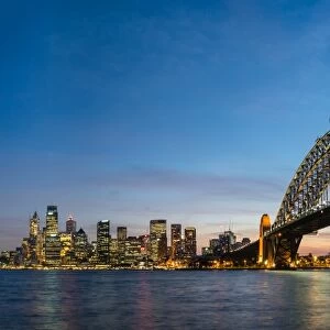 Sydneys iconic buildings lit up as dusk settles over the city, Sydney, New South Wales