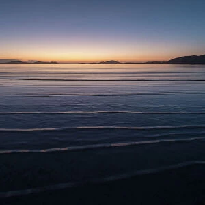 Winter sunrise at high tide, Traigh Mhor, the beach used as Barra Airport at low tide
