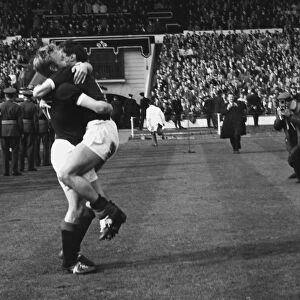 Scotlands Davie Wilson hugs a teammate after victory at Wembley - 1962 / 3 British Home Championship