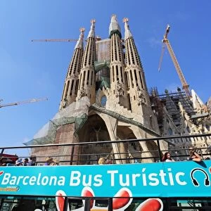 Barcelona City Tour sightseeing Touristic bus for tourists at the Basilica de la Sagrada Familia cathedral in Barcelona, Spain