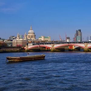 River Thames with Blackfriars Bridge and the City of London skyline in London, England