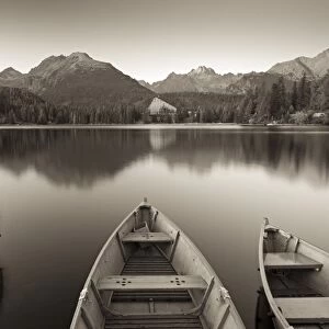 Rowing boats and mountains beneath a twilight sky, Strbske Pleso Lake in the High Tatras
