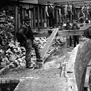 View of workers during the construction of Granton Gas Works. Titled: Brickwork at Bottom of tank on North side. 1st November 1899