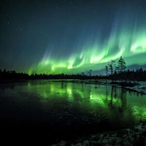 The Aurora Borealis (Northern Lights) is seen over the sky near Rovaniemi in Lapland