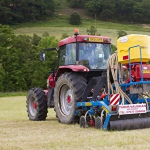 Contractor with McCormick MC120 tractor and ERTH Agriseeder precision slot seeder