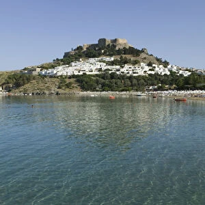 GREECE-Dodecanese Islands-RHODES-Lindos: Lindos Harbor- Beach View with Acropolis
