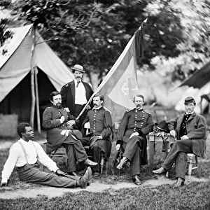 CIVIL WAR: OFFICERS, 1865. Union Army Brigadier General Napoleon McLaughlin and his staff. Photographed near Washington, D. C. 1865