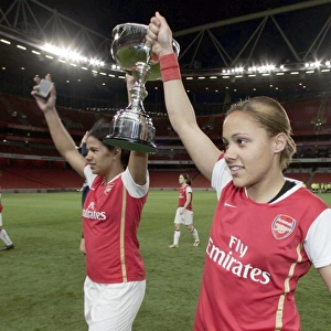 Alex Scott and Mary Phillip (Arsenal) with the Premier League Trophy