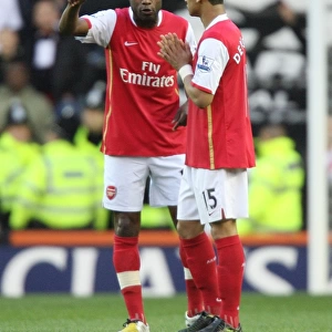 Arsenal captain William Gallas talks with Denilson before the match