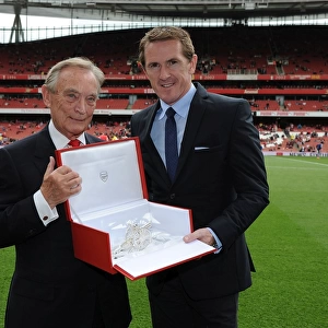 Arsenal Honors Retired Jockey AP McCoy with Silver Cannon at Arsenal vs. West Bromwich Albion Match