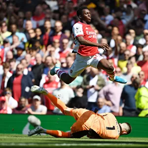 Arsenal's Eddie Nketiah Leaps Over Meslier in Thrilling Arsenal v Leeds United Clash, Premier League 2021-22